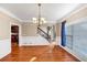 Bright dining room with hardwood floors, detailed trim, and chandelier lighting at 101 Lumby Ln, Stockbridge, GA 30281