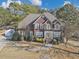 Charming two-story brick home with manicured landscaping and a circular driveway at 101 Lumby Ln, Stockbridge, GA 30281