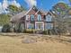 Charming brick two-story home with manicured lawn and mature trees at 101 Lumby Ln, Stockbridge, GA 30281