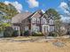 Charming brick two-story home with manicured lawn and mature trees at 101 Lumby Ln, Stockbridge, GA 30281