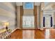 Elegant foyer featuring hardwood floors and beautiful front door with side windows at 101 Lumby Ln, Stockbridge, GA 30281