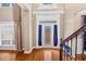 Elegant foyer featuring hardwood floors and beautiful front door with side windows at 101 Lumby Ln, Stockbridge, GA 30281
