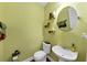 Charming half bathroom with a vessel sink, decorative shelves, and painted green walls at 101 Lumby Ln, Stockbridge, GA 30281