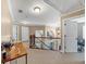 Upper level hallway with wood railing, chandelier, and neutral decor at 101 Lumby Ln, Stockbridge, GA 30281