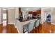 Open kitchen with granite countertops, stainless steel appliances, and breakfast bar seating, seamlessly connected at 101 Lumby Ln, Stockbridge, GA 30281