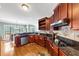Functional kitchen features granite countertops, stainless appliances, breakfast bar, and warm wood cabinetry at 101 Lumby Ln, Stockbridge, GA 30281