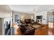 Open-concept living room with a fireplace, hardwood floors, and a ceiling fan, perfect for entertaining at 101 Lumby Ln, Stockbridge, GA 30281