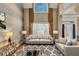 Bright living room with hardwood floors, tall ceilings, and modern decor at 101 Lumby Ln, Stockbridge, GA 30281
