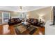 Spacious living room boasts hardwood floors, a ceiling fan, and large windows for ample natural light at 101 Lumby Ln, Stockbridge, GA 30281