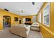 Bright living room with neutral carpeting, plush seating, and a large screen television at 101 Lumby Ln, Stockbridge, GA 30281