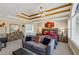 A spacious main bedroom featuring tray ceilings, sitting area, and ensuite bathroom access at 101 Lumby Ln, Stockbridge, GA 30281