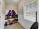 Mud room with tile floor, a bench and coat hooks for storing shoes and outerwear at 101 Lumby Ln, Stockbridge, GA 30281