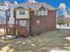 Brick home with a wooden deck and a view of the surrounding yard at 101 Lumby Ln, Stockbridge, GA 30281
