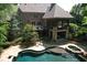 An entertainer's backyard featuring a multi-level deck and pool, perfect for outdoor gatherings and relaxation at 1023 Little Darby Ln, Suwanee, GA 30024