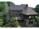 Inviting backyard with covered patio, deck, and pool offering an ideal setting for outdoor relaxation and entertainment at 1023 Little Darby Ln, Suwanee, GA 30024