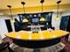 Entertain in style at this custom bar featuring black cabinets, beverage cooler, and unique lighting at 1023 Little Darby Ln, Suwanee, GA 30024