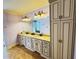 A luxurious bathroom boasts a double vanity and granite countertop, complemented by a stylish vanity lighting fixture at 1023 Little Darby Ln, Suwanee, GA 30024