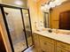 A bathroom featuring a glass-enclosed shower, granite countertops, and bright lighting for a spa-like feel at 1023 Little Darby Ln, Suwanee, GA 30024