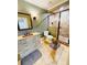 Well-appointed bathroom featuring a vanity with an eye-catching copper sink and a glass-enclosed shower at 1023 Little Darby Ln, Suwanee, GA 30024