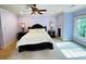 Serene bedroom with custom trim, and ample natural light, creating a peaceful retreat at 1023 Little Darby Ln, Suwanee, GA 30024
