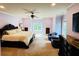 Generously sized bedroom with elegant crown molding, comfortable seating, and plenty of natural light at 1023 Little Darby Ln, Suwanee, GA 30024