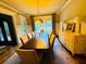 Formal dining room featuring an ornate chandelier, wood floors, and sideboard at 1023 Little Darby Ln, Suwanee, GA 30024