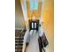 High angle view of foyer with staircase and decorative wrought iron double doors at 1023 Little Darby Ln, Suwanee, GA 30024