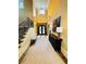 Spacious foyer with high ceilings, staircase, and wrought iron double doors at 1023 Little Darby Ln, Suwanee, GA 30024