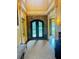 Grand entryway with decorative wrought iron double doors and stone accent wall at 1023 Little Darby Ln, Suwanee, GA 30024