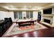 Enjoy entertaining in this game room, featuring a pool table, stone fireplace, and arcade games at 1023 Little Darby Ln, Suwanee, GA 30024