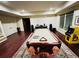 Bright game room featuring a pool table, vintage arcade game and stone fireplace, perfect for entertaining at 1023 Little Darby Ln, Suwanee, GA 30024