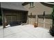 A three car garage with neutral doors and stone accents, with convenient parking and ample storage space at 1023 Little Darby Ln, Suwanee, GA 30024