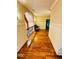 An upstairs hallway with hardwood flooring and classic trim details provides access to additional living spaces at 1023 Little Darby Ln, Suwanee, GA 30024