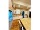 Well-appointed kitchen features a large island, white cabinets, and hardwood floors at 1023 Little Darby Ln, Suwanee, GA 30024