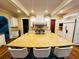 Spacious kitchen featuring a large island, white cabinets, and stainless steel appliances at 1023 Little Darby Ln, Suwanee, GA 30024