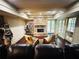 Cozy living room featuring a stone fireplace and French doors, perfect for relaxing or entertaining at 1023 Little Darby Ln, Suwanee, GA 30024