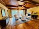 Cozy living room features a fireplace, hardwood floors, and ample seating at 1023 Little Darby Ln, Suwanee, GA 30024