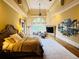 Large main bedroom with high ceilings, a fireplace, sitting area, and an ensuite bathroom at 1023 Little Darby Ln, Suwanee, GA 30024