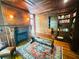 This office boasts wood-paneled walls, a fireplace, built-in bookshelves, hardwood floors, and an ornate desk at 1023 Little Darby Ln, Suwanee, GA 30024