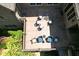 Aerial view of a charming patio with outdoor seating and lush landscaping, perfect for relaxing and entertaining at 1023 Little Darby Ln, Suwanee, GA 30024