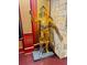 A life-sized replica of C3PO with lights stands tall in a themed room with stone accents and dark hardwood floors at 1023 Little Darby Ln, Suwanee, GA 30024
