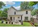 Backyard with patio featuring outdoor furniture and barbecue grill, surrounded by well-maintained lawn at 3388 Washington Cmns Nw Ave, Kennesaw, GA 30144