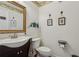 Half bathroom with vanity and toilet at 3388 Washington Cmns Nw Ave, Kennesaw, GA 30144