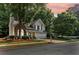 Charming home with brick facade, two-car garage, and mature trees at 3388 Washington Cmns Nw Ave, Kennesaw, GA 30144
