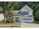 Charming two-story home with a well-manicured lawn and a two-car garage in a great neighborhood at 3388 Washington Cmns Nw Ave, Kennesaw, GA 30144