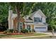 Beautifully landscaped two-story home with brick facade and a well-maintained lawn in a Gathering-friendly neighborhood at 3388 Washington Cmns Nw Ave, Kennesaw, GA 30144