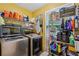 Laundry room with washer, dryer, shelves and organizing system at 3388 Washington Cmns Nw Ave, Kennesaw, GA 30144