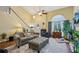 Bright living room with high ceilings, large windows, neutral walls, hardwood floors and comfortable seating at 3388 Washington Cmns Nw Ave, Kennesaw, GA 30144
