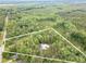 Aerial view showcasing the property's vast wooded surroundings and large lot at 379 Bohannon Rd, Grantville, GA 30220
