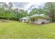 Well-maintained backyard showcasing expansive green lawn and mature trees at 379 Bohannon Rd, Grantville, GA 30220